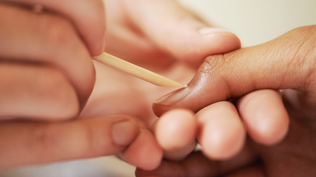 The cuticle is carefully pushed back with a rosewood stick or a horse's foot.