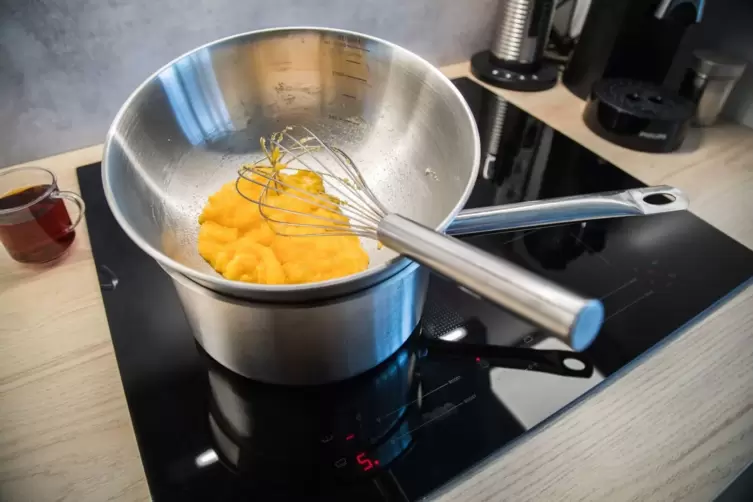 Egg yolks and sugar in a bowl