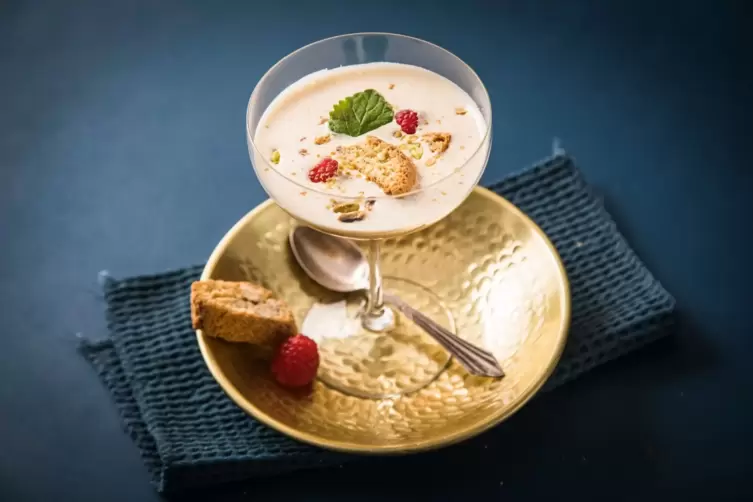 Zabaione with pistachios, raspberries and lemon balm