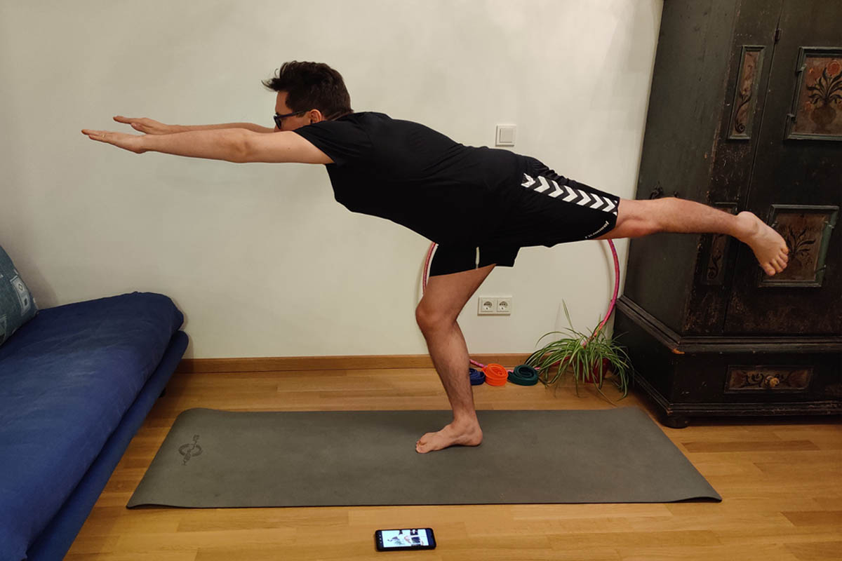 A man does the stretching exercise scales