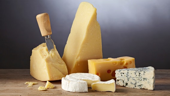 Various types of cheese on a wooden board. © Colourbox Photo: -