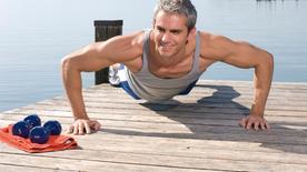 Man doing push-ups on jetty