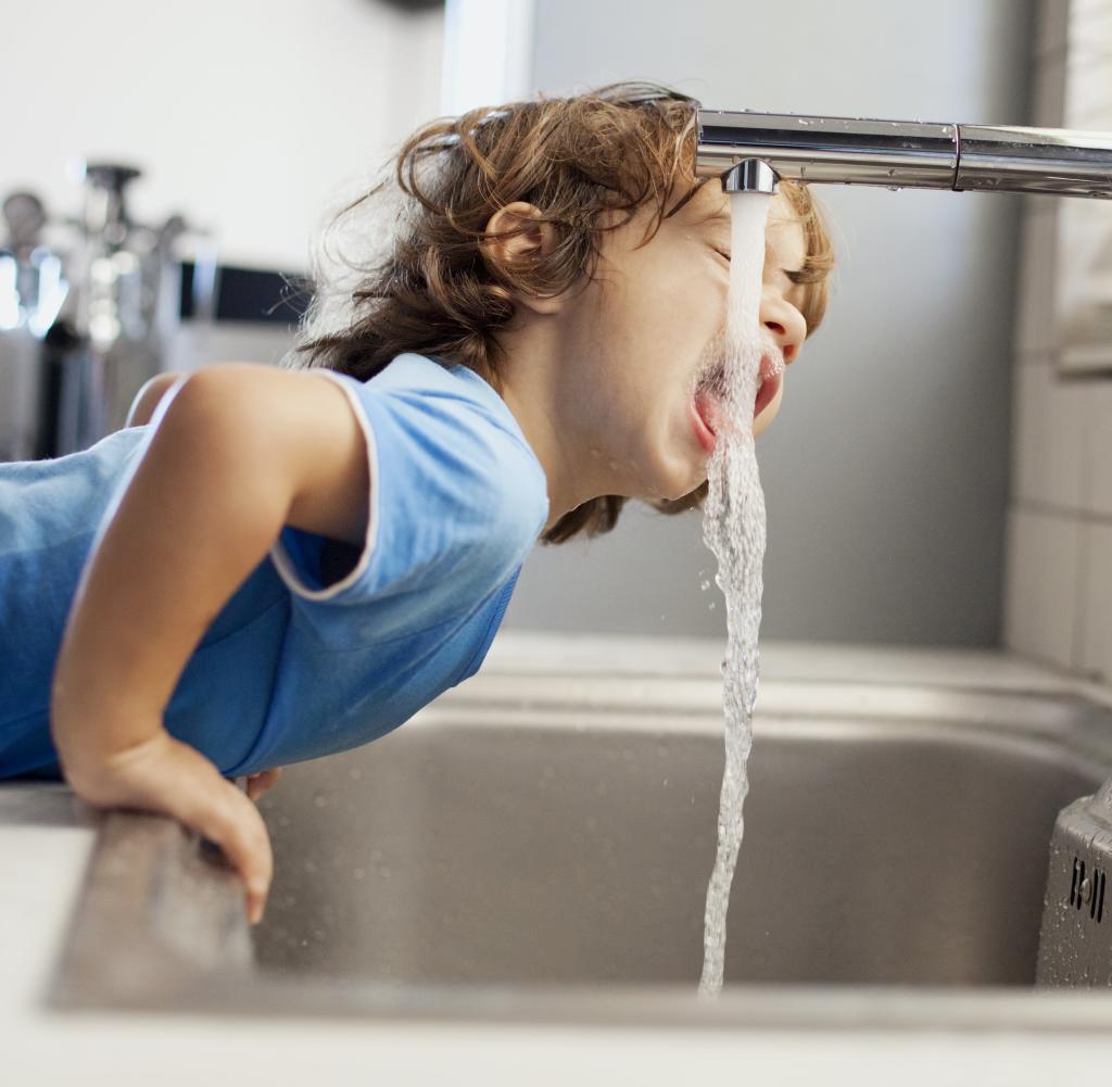 Little boy drinking water